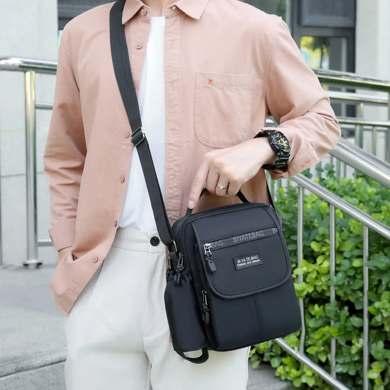 XIANGTUIBAO New Shoulder Bag Men's Oxford Cloth Messenger Bag Men's Business Outdoor Casual Vertical and Portable Design Small Bag Men's Water Cup Bag