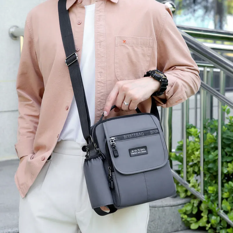 XIANGTUIBAO New Shoulder Bag Men's Oxford Cloth Messenger Bag Men's Business Outdoor Casual Vertical and Portable Design Small Bag Men's Water Cup Bag